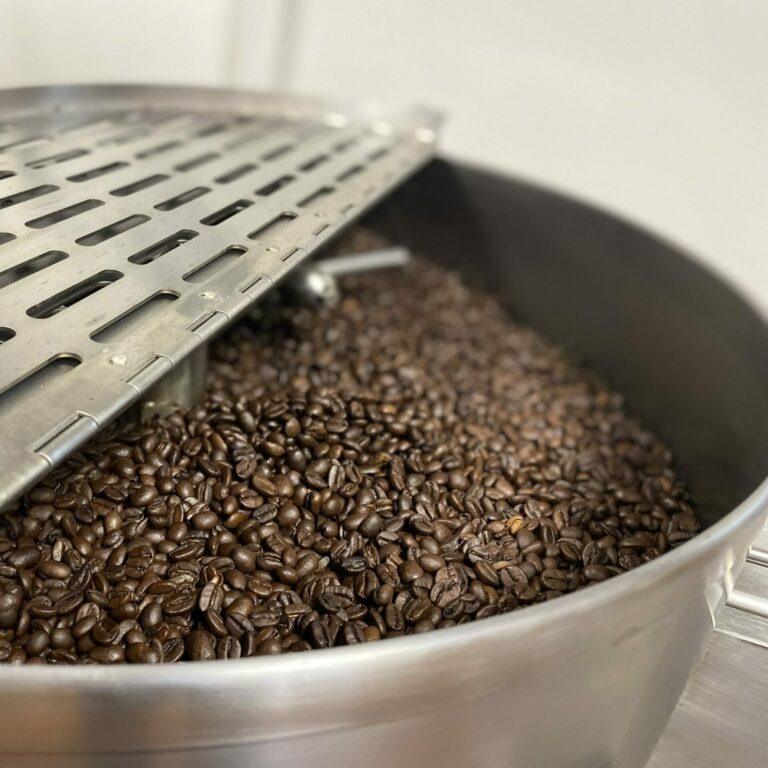 Freshly roasted Haven coffee beans cooling after a small-batch roast